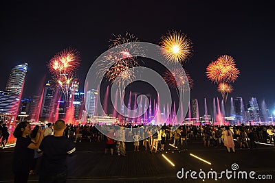 Tourists visit SPECTRA â€“ LIGHT & WATER SHOW at Marina bay sand Editorial Stock Photo